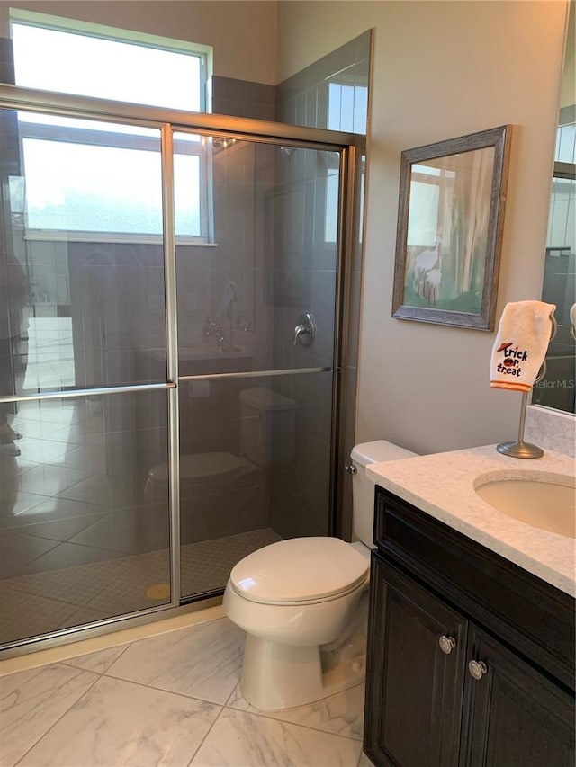 16015 Cape Coral Dr, Wimauma, FL 33598 - bathroom with vanity, toilet, marble look tile flooring, and a shower stall