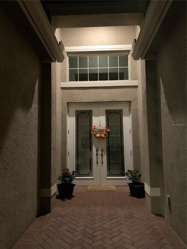 16015 Cape Coral Dr, Wimauma, FL 33598 - property entrance featuring french doors and stucco siding
