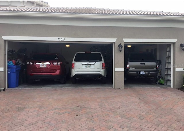 16015 Cape Coral Dr, Wimauma, FL 33598 - garage with decorative driveway