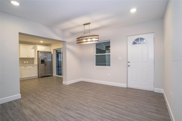 entryway with hardwood / wood-style flooring