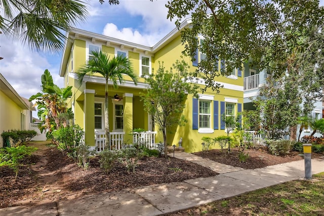 view of front of property with a balcony and covered porch