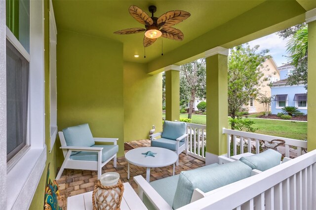 view of patio with ceiling fan, outdoor lounge area, and covered porch