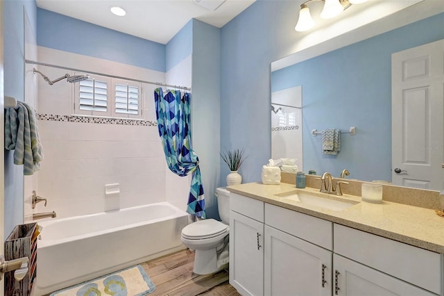 full bathroom featuring shower / bath combination with curtain, wood-type flooring, vanity, and toilet