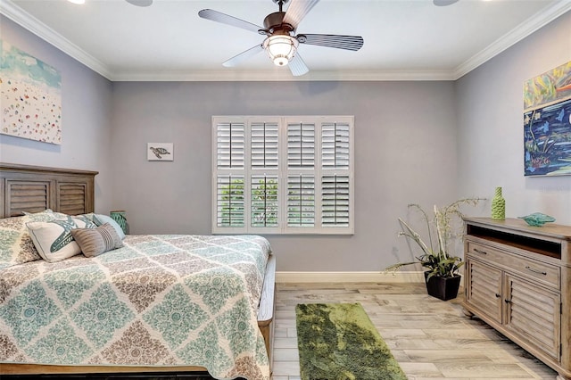 bedroom featuring ceiling fan, ornamental molding, and light hardwood / wood-style floors