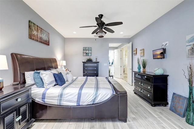 bedroom with light hardwood / wood-style floors and ceiling fan