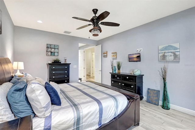 bedroom featuring light wood-type flooring and ceiling fan