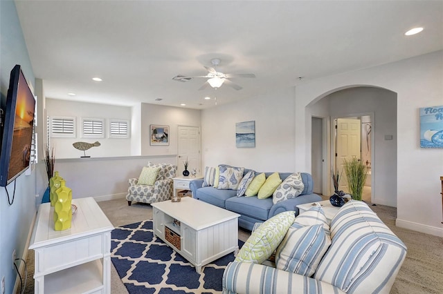 living room featuring ceiling fan and light carpet