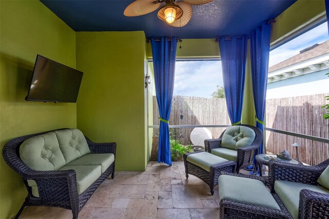 interior space featuring ceiling fan