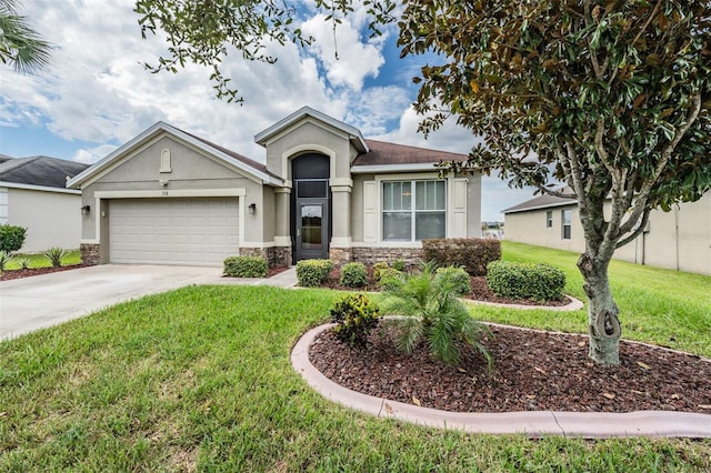 view of front of home with a garage and a front yard