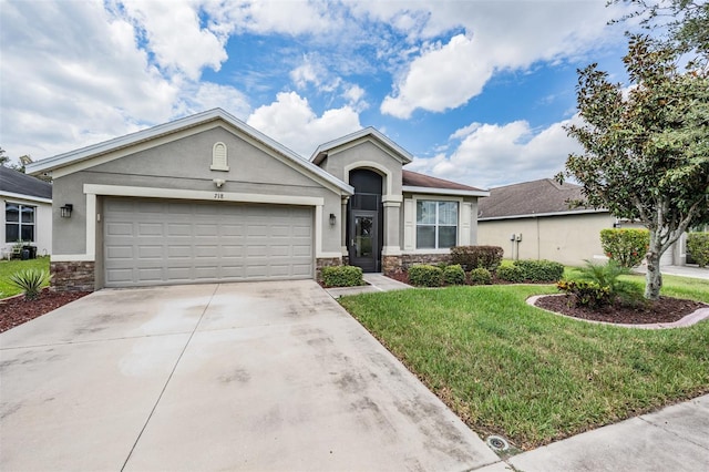 single story home featuring a garage and a front lawn