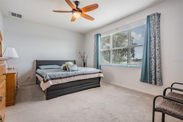 bedroom featuring ceiling fan and carpet