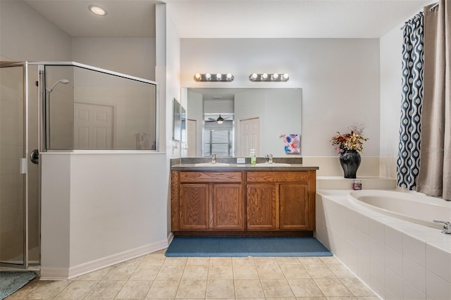 bathroom featuring vanity, separate shower and tub, and tile patterned floors