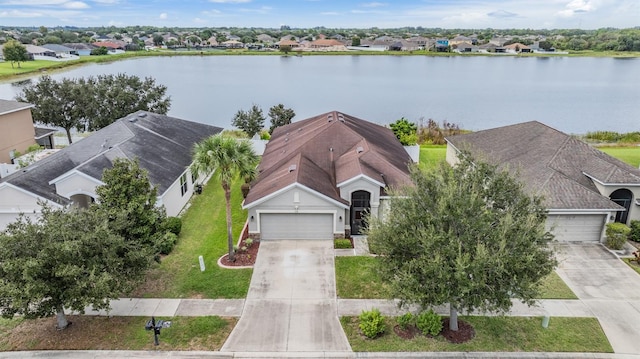 birds eye view of property with a water view