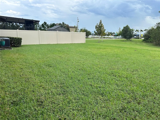 view of yard with central AC unit