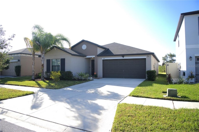 single story home featuring a garage and a front yard