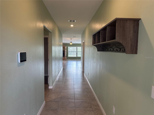 corridor with tile patterned flooring