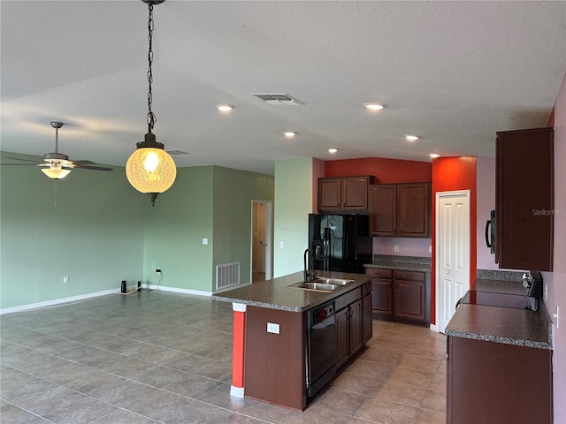 kitchen featuring black appliances, a textured ceiling, sink, ceiling fan, and a kitchen island with sink