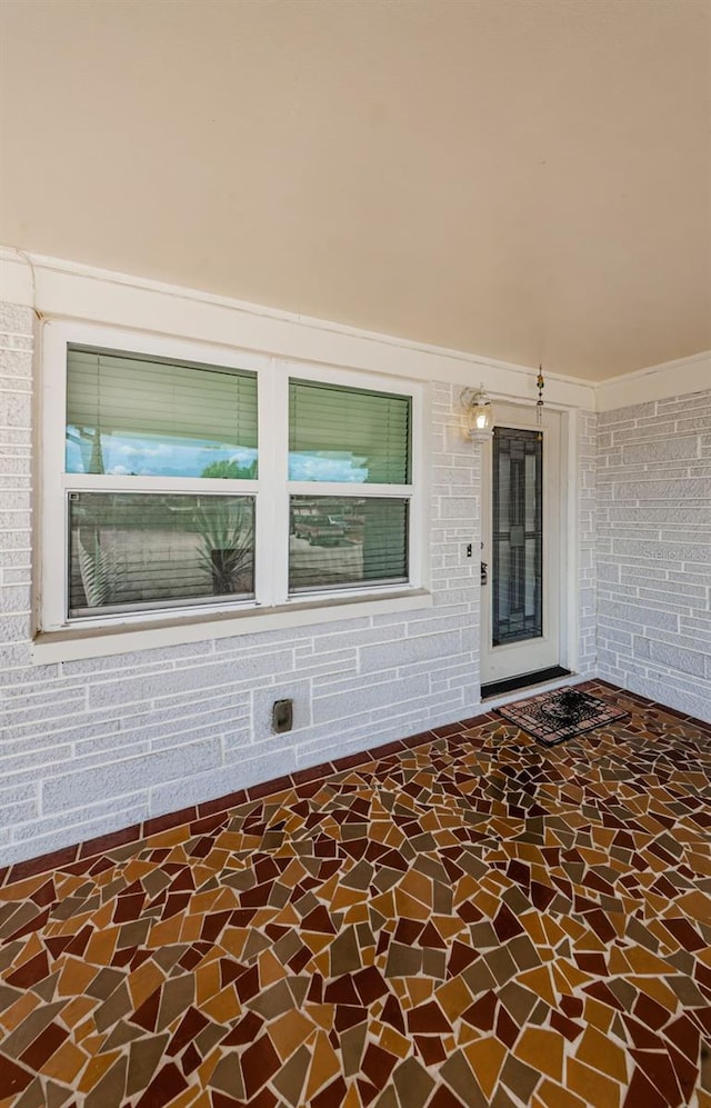 doorway to property with a patio area