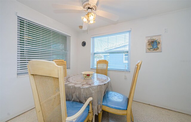 dining area with ceiling fan