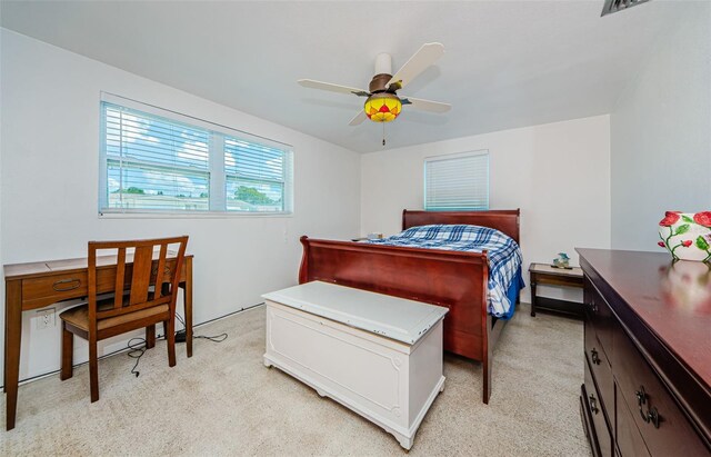 bedroom featuring ceiling fan and light colored carpet