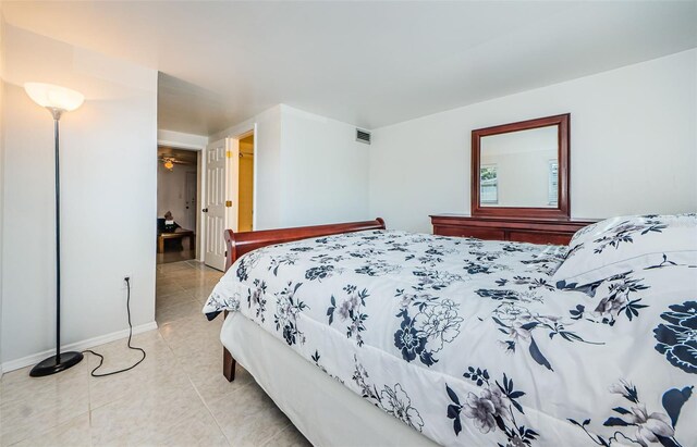 bedroom featuring light tile patterned flooring