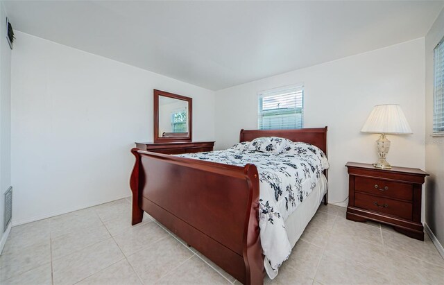 bedroom featuring light tile patterned flooring