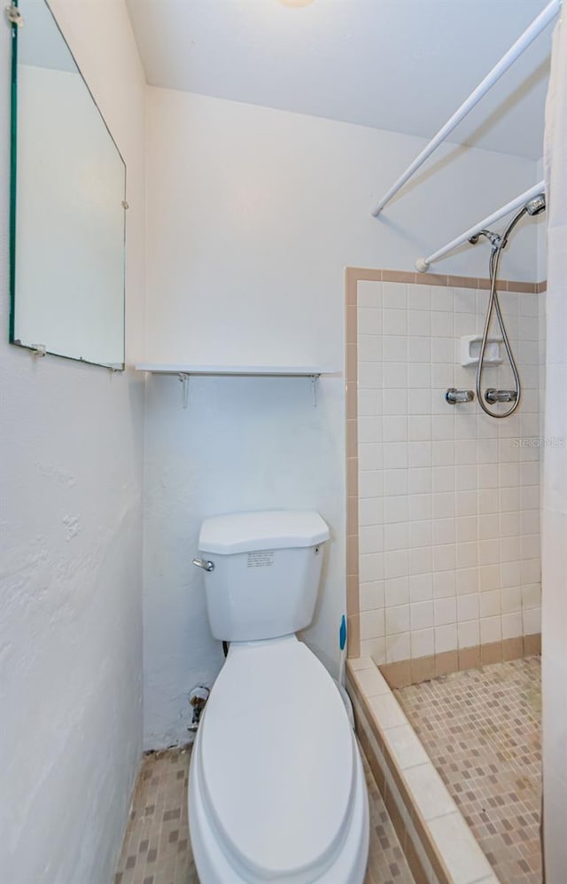 bathroom with toilet and curtained shower