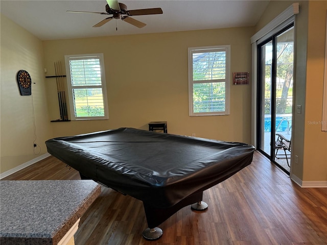 game room featuring ceiling fan, billiards, hardwood / wood-style floors, and a wealth of natural light