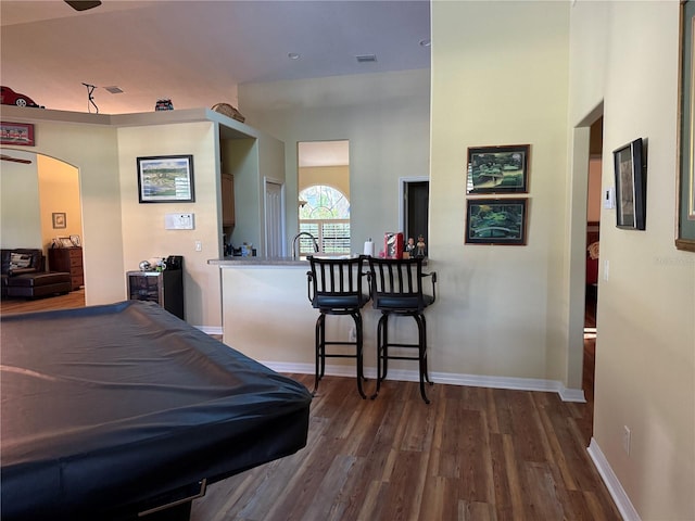 interior space with dark hardwood / wood-style flooring and sink