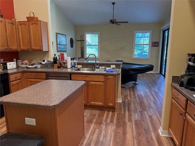 kitchen featuring a kitchen island, dark hardwood / wood-style flooring, ceiling fan, and sink