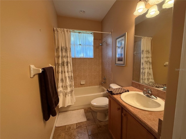 full bathroom featuring shower / tub combo, vanity, and toilet