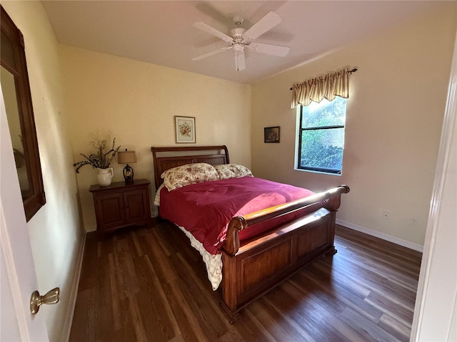 bedroom with ceiling fan and dark hardwood / wood-style floors