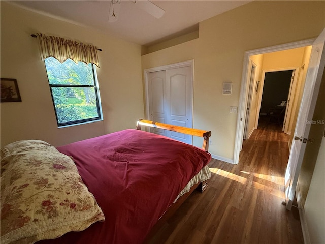 bedroom with a closet, ceiling fan, and hardwood / wood-style floors