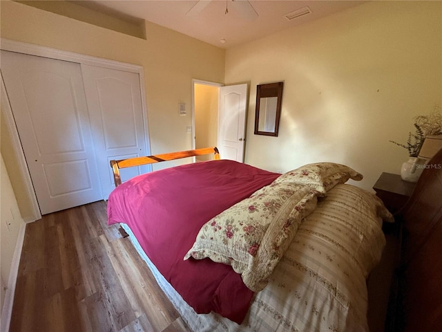 bedroom featuring wood-type flooring, a closet, and ceiling fan