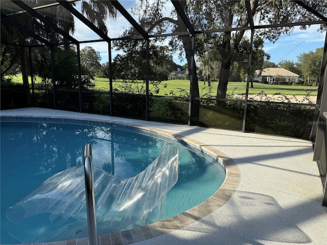 view of pool with a lanai and a patio area