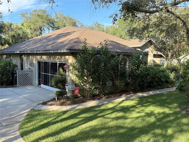 view of side of property featuring a yard