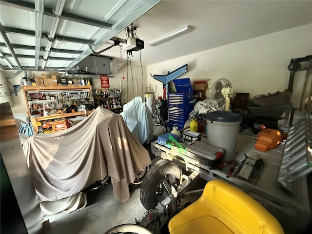 garage featuring a garage door opener and a workshop area