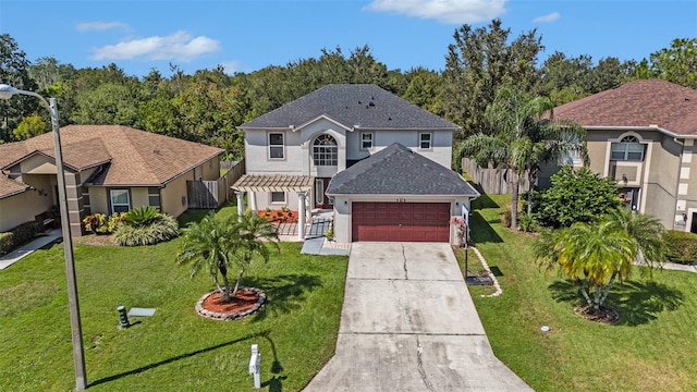 view of front of house with a front yard and a garage