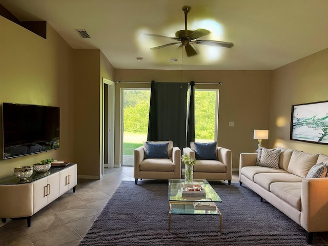 living room with ceiling fan and light tile patterned floors