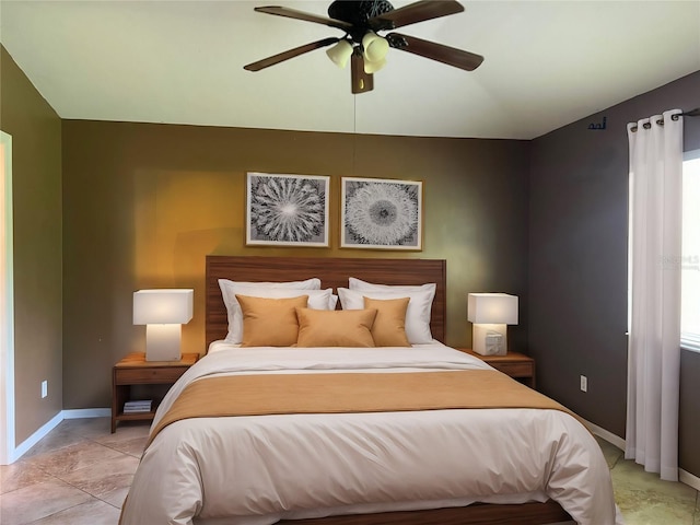 bedroom featuring ceiling fan and light tile patterned flooring