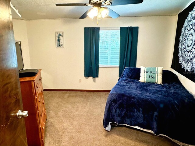 bedroom featuring ceiling fan and light colored carpet