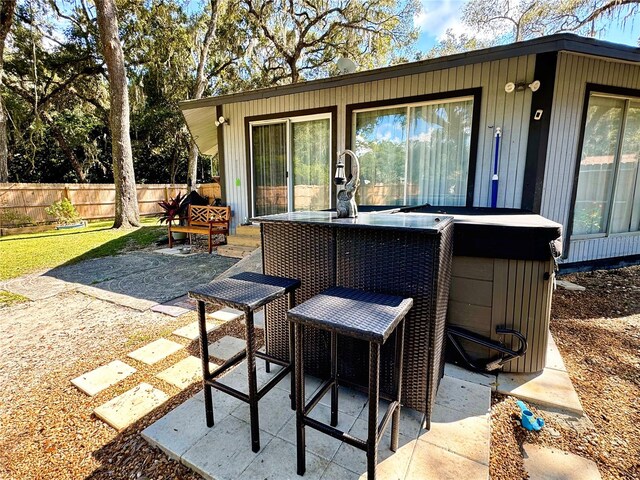 view of patio / terrace featuring a hot tub