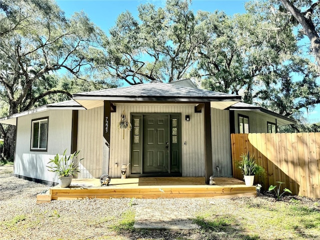 view of outdoor structure featuring covered porch