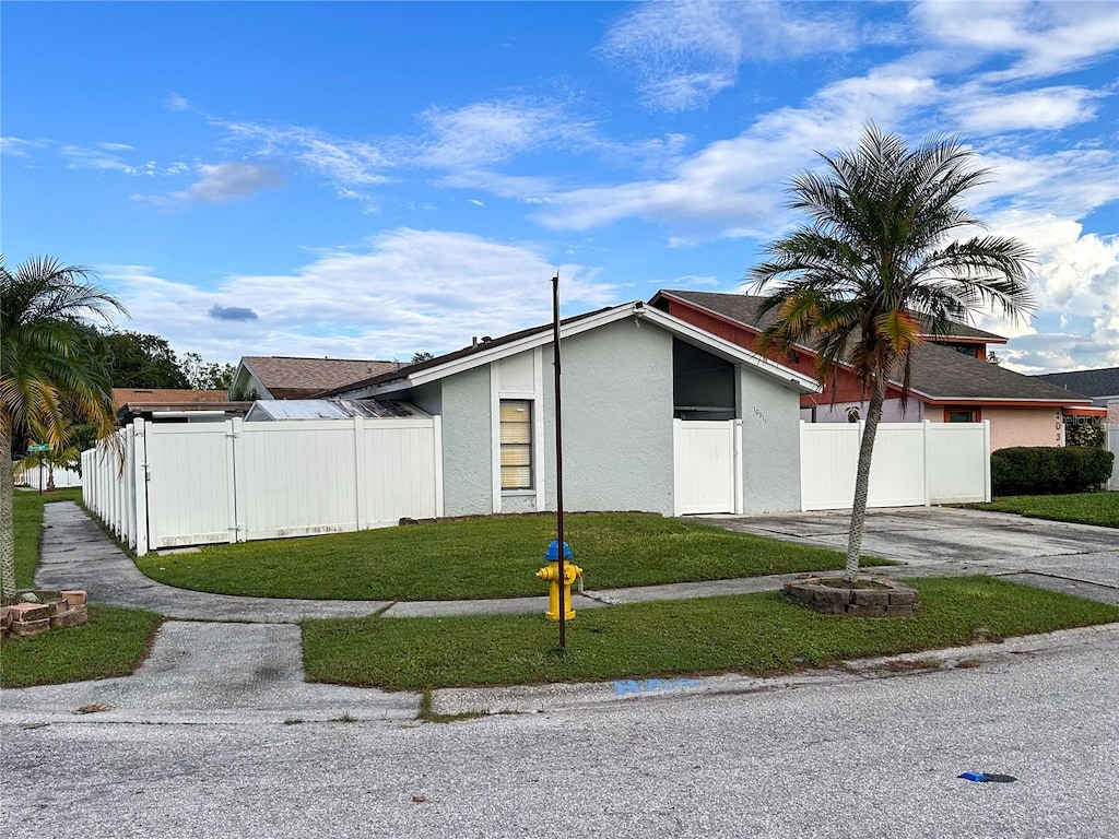 view of property exterior with a yard