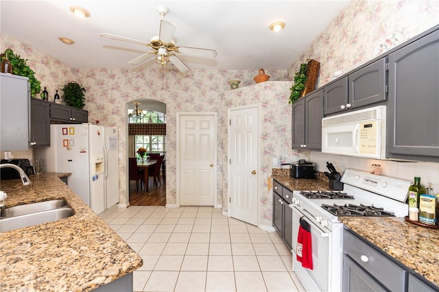 kitchen with gray cabinets, sink, white appliances, light tile patterned floors, and ceiling fan