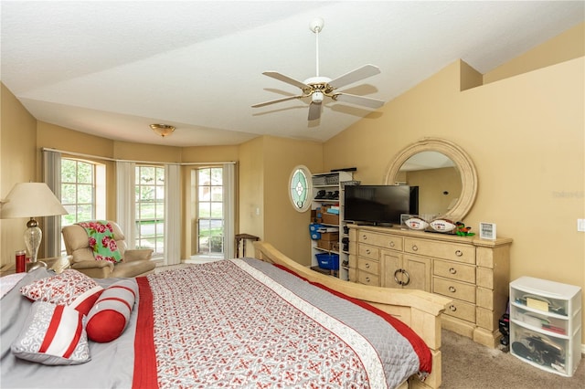 carpeted bedroom with lofted ceiling and ceiling fan