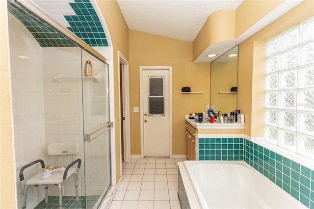 bathroom featuring a textured ceiling, vanity, separate shower and tub, and tile patterned floors