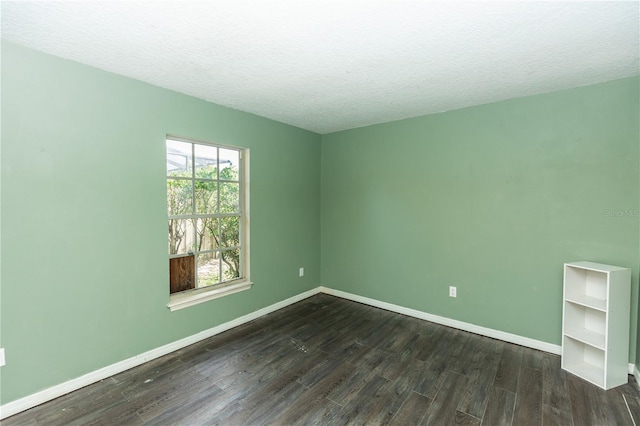 107 Needlewood Loop, Debary, FL 32713 - unfurnished room with dark wood finished floors, a textured ceiling, and baseboards