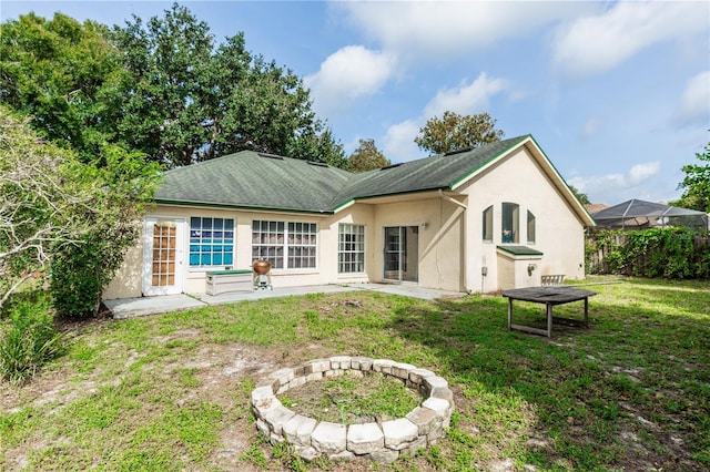 107 Needlewood Loop, Debary, FL 32713 - rear view of house with stucco siding and a yard