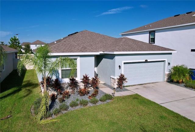 view of front facade featuring a front yard and a garage